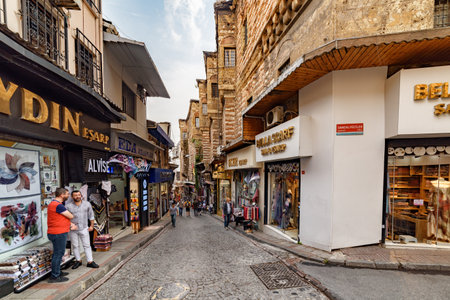 Istanbul, Turkey - September 15, 2021: Awesome view of an old narrow street and the Buyuk Yeni Han at the right side. The large historic caravanserai is a popular tourist attraction in Turkey.のeditorial素材