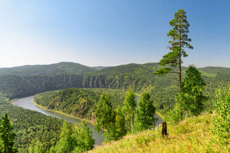 Awesome view of scenic river among evergreen woods. Awesome landscape.の写真素材