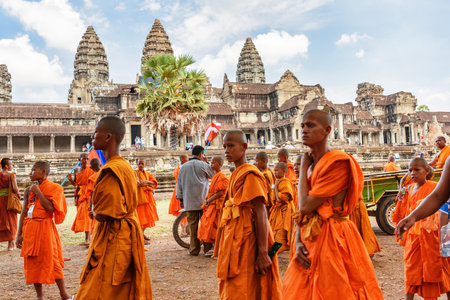 Siem Reap, Cambodia - May 2, 2015: Buddhist monks in ancient Angkor Wat temple. Angkor Wat is a popular destination of tourists and pilgrims.のeditorial素材