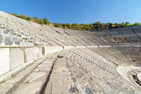The Theatre of Ephesus (Efes) at Selcuk in Izmir Province, Turkey. The amphitheatre is the largest in the ancient world for gladiatorial combats and drama. Ephesus is a popular tourist destination.の写真素材