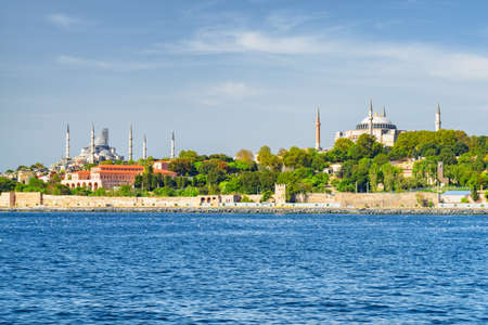 Scenic view of the Sultan Ahmed Mosque (the Blue Mosque) and the Hagia Sophia from the Bosporus in Istanbul, Turkey. Awesome Istanbul skyline. The city is a popular tourist destination of the world.の写真素材