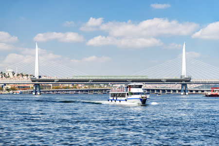 Awesome view of the Golden Horn Metro Bridge. Ship is crossing the Golden Horn. Istanbul is a popular tourist destination of the world.の写真素材
