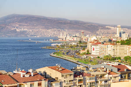 Awesome aerial view of scenic coastline of Izmir, Turkey. The Gulf of Izmir on the Aegean Sea is visible at the left. Amazing cityscape. The city is a popular tourist destination in Turkey.の写真素材