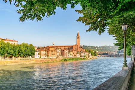 View of waterfront of the Adige River in Verona, Italy. Verona is a popular tourist destination of Europe.の写真素材