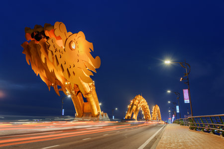 Da Nang (Danang), Vietnam - April 14, 2018: Wonderful night view of the Dragon Bridge (Cau Rong) over the Han River at downtown. The Dragon Bridge is a popular tourist attraction of Asia.のeditorial素材