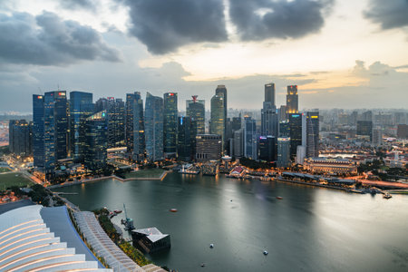 Singapore - February 19, 2017: Awesome aerial view of Marina Bay and skyscrapers of downtown at sunset. Amazing Singapore skyline. Singapore is a popular tourist destination of Asia.のeditorial素材