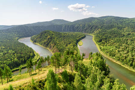 Awesome view of scenic river among evergreen woods. Awesome landscape.の写真素材