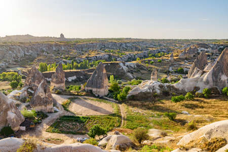 Awesome view of rock formations called the Fairy Chimneys in Cappadocia, Turkey. Fabulous landscape of Goreme Historical National Park. Cappadocia is a popular tourist destination of Turkey.の写真素材