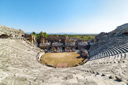 View of the ancient theatre in Side, Turkey. Side is a popular tourist destination in Turkey.の写真素材