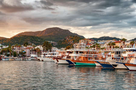 Sunset view of boats in Marmaris, Turkey. The port city is a popular tourist destination in the Turkish Riviera.の写真素材