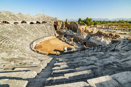 Aerial view of the ancient theatre in Side, Turkey. Drone flying around the scenic ruins. Side is a popular tourist destination in Turkey.の写真素材