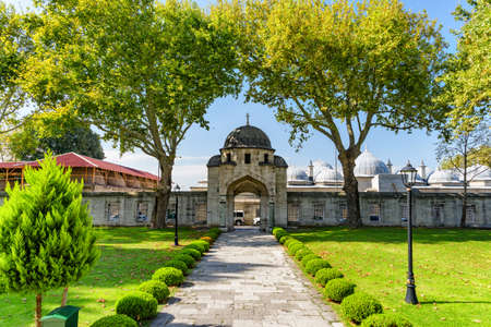 Awesome view of a scenic gate to the green gardens of the Suleymaniye Mosque in Istanbul, Turkey. The Ottoman imperial mosque is a popular destination among pilgrims and tourists of the world.の写真素材