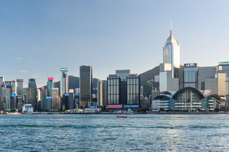 Hong Kong - November 8, 2015: View of Hong Kong Island skyline across Victoria harbor. Amazing cityscape. Hong Kong is a popular tourist destination of Asia.のeditorial素材