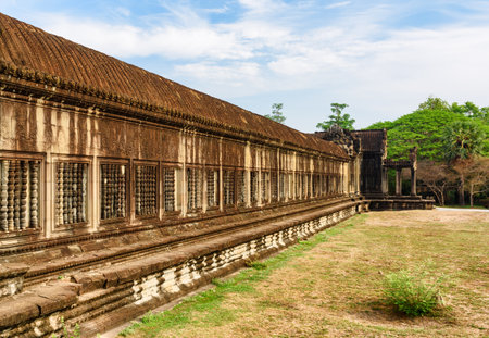 View of ancient temple complex Angkor Wat in Siem Reap, Cambodia. Angkor Wat is a popular tourist attraction.の写真素材