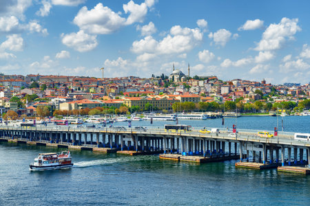 View of the Ataturk Bridge over the Golden Horn in Istanbul, Turkey. The Fatih Mosque is visible in background. Istanbul is a popular tourist destination of the world.の写真素材