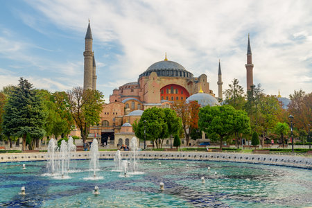 Fountain at Sultanahmet Square and the Hagia Sophia in Istanbul, Turkey. The Sultanahmet Square is a popular tourist attraction of Istanbul.の写真素材