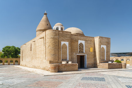 Awesome view of Chashma-Ayub Mausoleum in Historic Center of Bukhara, Uzbekistan. The ancient legendary well is a popular tourist attraction of Central Asia.の写真素材