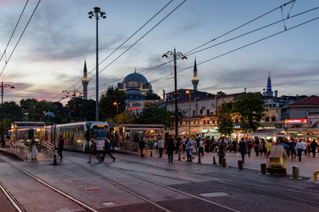Istanbul, Turkey - September 15, 2021: Dusk view of tramway in the Beyazit Square area of Fatih District. The Istanbul Tram is modern tram system on the European side of the city.のeditorial素材