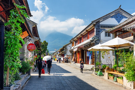 Dali, China - October 21, 2015: View of old houses at ancient city of Dali. Scenic street of Dali Old Town in autumn.のeditorial素材