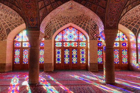 Shiraz, Iran - 31 October, 2018: Scenic morning sunlight reflected through colorful stained glass windows on the floor of prayer hall at the Nasir al-Mulk Mosque (Pink Mosque).のeditorial素材