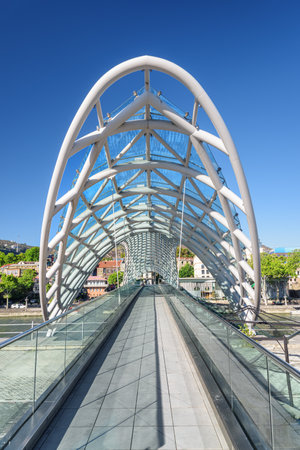 Tbilisi, Georgia - 8 October, 2022: Awesome inside view of the Bridge of Peace over the Kura (Mtkvari) River. Tbilisi is a popular tourist destination of the Caucasus region.のeditorial素材