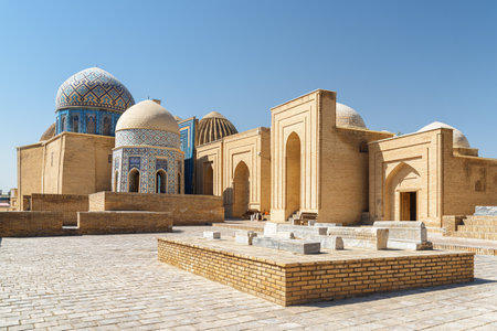Awesome view of the Shah-i-Zinda Ensemble in Samarkand, Uzbekistan. Mausoleums decorated by blue tiles with designs. The necropolis is a popular tourist attraction of Central Asia.の写真素材