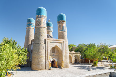 Awesome view of Chor Minor (the Madrasah of Khalif Niyaz-kul) in Bukhara, Uzbekistan. The historic gatehouse with four towers is a popular tourist attraction of Central Asia.の写真素材