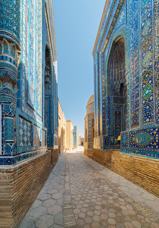View of the Shah-i-Zinda Ensemble in Samarkand, Uzbekistan. Mausoleums decorated by blue tiles with designs. The necropolis is a popular tourist attraction of Central Asia.の写真素材
