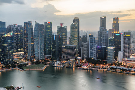 Singapore - February 19, 2017: Awesome aerial view of Marina Bay and skyscrapers of downtown at sunset. Amazing Singapore skyline. Singapore is a popular tourist destination of Asia.のeditorial素材