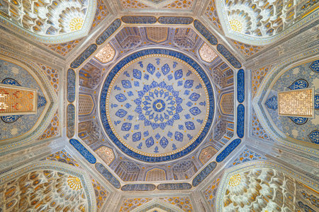 View of ceiling in the Shah-i-Zinda Ensemble in Samarkand, Uzbekistan. Ceiling decorated by blue tiles with designs. The necropolis is a popular tourist attraction of Central Asia.のeditorial素材