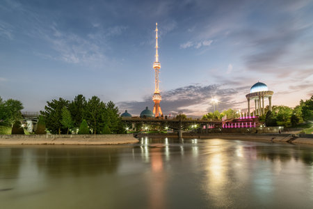 Evening view of Tashkent TV Tower and rotunda at the Memorial Shakhidlar Hotirasi complex (Memories of victims of political repression) in Uzbekistan. Tashkent is a popular tourist destination.の写真素材