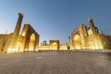Evening view of the Registan Square in Samarkand, Uzbekistan. The Ulugh Beg Madrasah, the Tilya-Kori Madrasah and the Sher-Dor Madrasah. The Registan is a popular tourist attraction of Central Asia.の写真素材