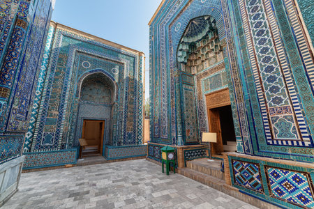 Awesome view of the upper group of mausoleums at the Shah-i-Zinda Ensemble in Samarkand, Uzbekistan. Mausoleums decorated by blue tiles with designs are a popular tourist attraction of Central Asia.の写真素材