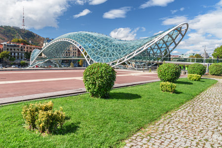 Awesome view of the Bridge of Peace over the Kura (Mtkvari) River in Tbilisi, Georgia. Tbilisi is a popular tourist destination of the Caucasus region.の写真素材