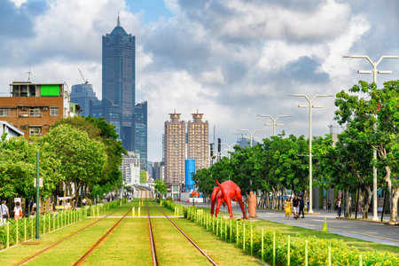 Kaohsiung, Taiwan - April 30, 2019: Scenic track of the Circular light rail KLRT. Awesome view of 85 Sky Tower (Tuntex Sky Tower). The skyscraper is a landmark of Taiwan. Amazing cityscape.のeditorial素材