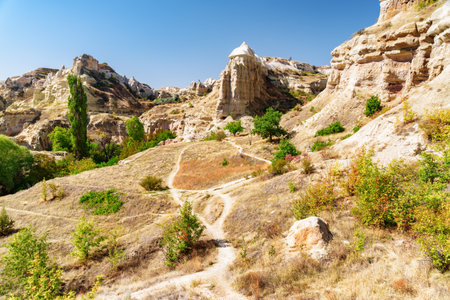 Awesome view of rock formations in the Pigeon valley in Cappadocia, Turkey. Fabulous landscape of Goreme Historical National Park. Cappadocia is a popular tourist destination of Turkey.の写真素材