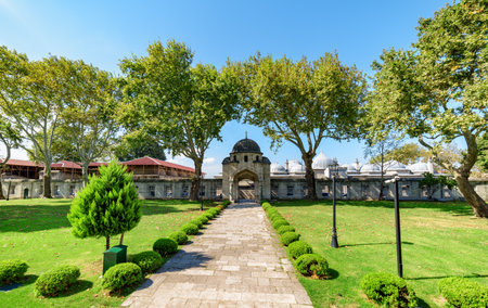 Awesome view of a scenic gate to the green gardens of the Suleymaniye Mosque in Istanbul, Turkey. The Ottoman imperial mosque is a popular destination among pilgrims and tourists of the world.の写真素材
