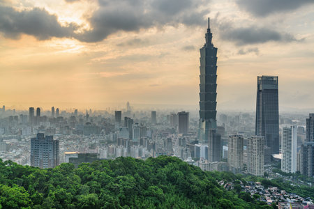 Awesome view of Taipei from top of mountain at sunset, Taiwan. Skyscrapers and other modern buildings of downtown. Amazing cityscape. Taipei is a popular tourist destination of Asia.の写真素材