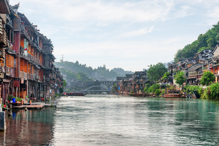 Awesome view of Phoenix Ancient Town (Fenghuang County) and the Tuojiang River (Tuo Jiang River) in China. Fenghuang is a popular tourist destination of Asia.の写真素材