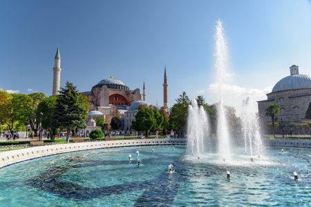 Fountain at Sultanahmet Square and the Hagia Sophia in Istanbul, Turkey. The Sultanahmet Square is a popular tourist attraction of Istanbul.の写真素材