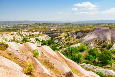 Awesome view of rock formations in the Pigeon valley in Cappadocia, Turkey. Fabulous landscape of Goreme Historical National Park. Cappadocia is a popular tourist destination of Turkey.の写真素材