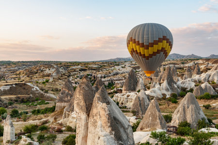 Awesome view of colorful hot air balloons flying over Goreme Historical National Park. Fabulous landscape of Cappadocia, Turkey.の写真素材
