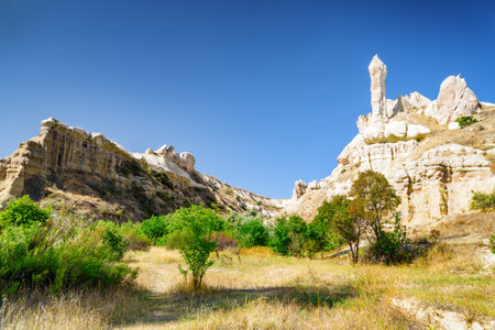 Awesome view of rock formations in the Pigeon valley in Cappadocia, Turkey. Fabulous landscape of Goreme Historical National Park. Cappadocia is a popular tourist destination of Turkey.の写真素材