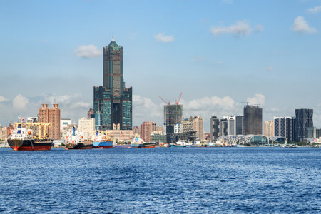 Awesome Kaohsiung skyline, Taiwan. Amazing view of Kaohsiung Harbor, 85 Sky Tower (Tuntex Sky Tower) and other modern buildings of downtown. The skyscraper is a landmark of Taiwan. Scenic cityscape.の写真素材