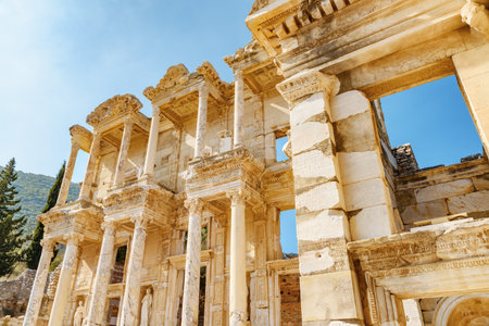 Awesome view of the Gate of Augustus and the Library of Celsus in Ephesus (Efes). Ruins of the ancient Greek city in Selcuk, Izmir Province, Turkey. Ephesus is a popular tourist attraction in Turkey.の写真素材