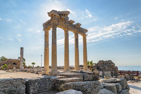 Awesome ruins of the Temple of Apollo on the Mediterranean Sea coast in Side, Turkey. The Roman temple is a popular tourist attraction in Turkey. Amazing view of columns on sunny day.の写真素材