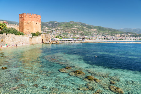 Awesome view of the Kizil Kule by the Mediterranean Sea in Alanya, Turkey. The Red Tower is a popular tourist attraction in Turkey.の写真素材