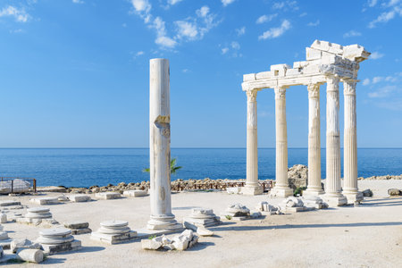 Awesome ruins of the Temple of Apollo on the Mediterranean Sea coast in Side, Turkey. The Roman temple is a popular tourist attraction in Turkey. Amazing view of columns on sunny day.の写真素材