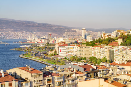 Awesome aerial view of scenic coastline of Izmir, Turkey. The Gulf of Izmir on the Aegean Sea is visible at the left. Amazing cityscape. The city is a popular tourist destination in Turkey.の写真素材