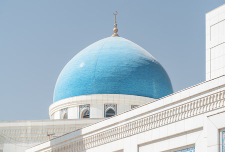 Awesome blue dome of Minor Mosque in Tashkent, Uzbekistan. The amazing white mosque is a popular tourist attraction of Central Asia.の写真素材